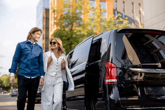 business-people-get-out-of-a-minivan-taxi-2025-03-13-15-32-31-utc-updated-1